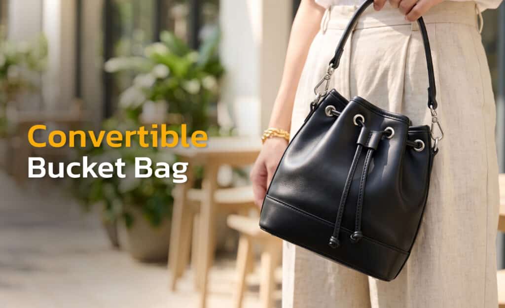 Convertible bucket bag with top zip and detachable strap, made by Suvino.